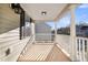 Inviting covered porch with white railings and sunny view at 1724 Bee Balm Rd, Johns Island, SC 29455