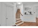 Staircase with carpeted steps and hardwood floors at 1724 Bee Balm Rd, Johns Island, SC 29455