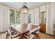 Formal dining room with a large table and access to the porch at 2256 Ion Ave, Sullivans Island, SC 29482