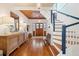 Bright and spacious entryway with hardwood floors and a grand staircase at 2256 Ion Ave, Sullivans Island, SC 29482