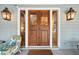 Elegant front entrance with a large wood door and sidelights at 2256 Ion Ave, Sullivans Island, SC 29482