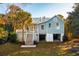 Charming light blue house with detached garage and spacious yard at 2256 Ion Ave, Sullivans Island, SC 29482