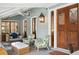 Relaxing porch with seating area, and wooden swing at 2256 Ion Ave, Sullivans Island, SC 29482
