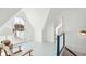 Light-filled upper floor with white walls, a sitting area, and access to a balcony at 2256 Ion Ave, Sullivans Island, SC 29482