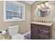 Clean bathroom, featuring a vanity with dark brown cabinets and a large mirror at 229 Millcreek Dr, Charleston, SC 29407