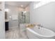 Bathroom with walk-in shower and freestanding bathtub at 229 Symphony Ave, Summerville, SC 29486