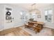 Bright dining room with farmhouse table, bench, and chandelier at 229 Symphony Ave, Summerville, SC 29486