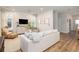 Spacious living room boasts a neutral color palette, hardwood floors, and ample natural light at 229 Symphony Ave, Summerville, SC 29486