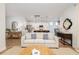 Open living room with hardwood floors and view of the kitchen and dining area at 229 Symphony Ave, Summerville, SC 29486