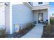 Front entrance with gray siding, black door, and walkway at 234 Parkwood Vista Way, Summerville, SC 29486