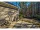 Cozy patio area with two chairs and a view of the wooded backyard at 2426 Tuscany Dr, North Charleston, SC 29406