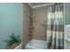 Bathroom with tub, shower, and updated tile at 2426 Tuscany Dr, North Charleston, SC 29406