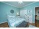 Guest bedroom with a queen bed, white dresser, and wood floors at 2426 Tuscany Dr, North Charleston, SC 29406