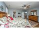 Main bedroom with ensuite bathroom access and wood furniture at 2426 Tuscany Dr, North Charleston, SC 29406