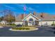 Two-story clubhouse with circular driveway and manicured landscaping at 2426 Tuscany Dr, North Charleston, SC 29406