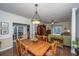 Spacious dining room with hardwood floors and a large wooden table at 2426 Tuscany Dr, North Charleston, SC 29406