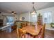 Open concept dining area with hardwood floors and view into living room at 2426 Tuscany Dr, North Charleston, SC 29406