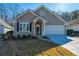 Craftsman style home with attached garage and manicured lawn at 2426 Tuscany Dr, North Charleston, SC 29406