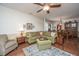 Comfortable living room with green sectional sofa and wood furniture at 2426 Tuscany Dr, North Charleston, SC 29406