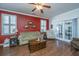 Living room with hardwood floors, green sofa, and access to patio at 2426 Tuscany Dr, North Charleston, SC 29406