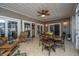 Sunroom with tiled floor, ceiling fan, and wicker furniture at 2426 Tuscany Dr, North Charleston, SC 29406