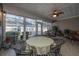 Sunroom with tiled floor, ceiling fan, and dining table at 2426 Tuscany Dr, North Charleston, SC 29406