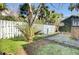 Landscaped backyard with stone patio and privacy fence at 30 Gibbes St, Charleston, SC 29401