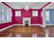 Bright living room with hardwood floors, fireplace and chandelier at 30 Gibbes St, Charleston, SC 29401