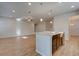 Kitchen island with granite countertop and stainless steel appliances at 306 Beachgrass Ln, Summerville, SC 29486