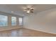 Spacious living room featuring hardwood floors and multiple windows at 306 Beachgrass Ln, Summerville, SC 29486