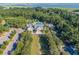 Aerial view of community pool, clubhouse, and surrounding landscape at 3168 Treadwell St, Mount Pleasant, SC 29466