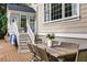 Outdoor dining area with a rustic wooden table and chairs at 3168 Treadwell St, Mount Pleasant, SC 29466
