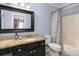 Clean bathroom with granite countertop, black cabinets and a shower/tub combo at 3168 Treadwell St, Mount Pleasant, SC 29466