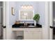 Simple bathroom with a vanity, black countertop, and large mirror at 3168 Treadwell St, Mount Pleasant, SC 29466