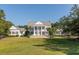 Elegant community clubhouse with a classic design and manicured lawn at 3168 Treadwell St, Mount Pleasant, SC 29466