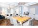 A light and airy dining room with a wooden table and wicker chairs at 3168 Treadwell St, Mount Pleasant, SC 29466