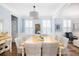 Spacious dining area with a large wooden table, wicker chairs, and hardwood floors at 3168 Treadwell St, Mount Pleasant, SC 29466