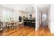 Eat-in kitchen with white cabinets, an island, and a charming breakfast nook at 3168 Treadwell St, Mount Pleasant, SC 29466