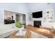 Spacious living room with a fireplace, built-in shelving, and hardwood floors at 3168 Treadwell St, Mount Pleasant, SC 29466