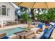 Inviting pool area with lounge chairs, and a wooden table at 3168 Treadwell St, Mount Pleasant, SC 29466