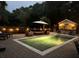 Night view of the pool, patio furniture and poolside bar at 3168 Treadwell St, Mount Pleasant, SC 29466