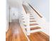 Elegant staircase with hardwood floors and white railing at 3168 Treadwell St, Mount Pleasant, SC 29466
