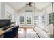 Bright sunroom features a built-in daybed, workspace, and serene views at 3168 Treadwell St, Mount Pleasant, SC 29466
