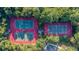 Two well-maintained tennis courts nestled within lush greenery at 3168 Treadwell St, Mount Pleasant, SC 29466