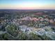 Sunset aerial view of house nestled in wooded area at 320 Harry Ln, Moncks Corner, SC 29461