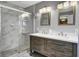 Modern bathroom with a walk-in shower, double vanity, and marble tile at 320 Harry Ln, Moncks Corner, SC 29461