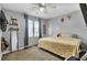 Comfortable bedroom with a king-size bed, ceiling fan, and plenty of natural light at 320 Harry Ln, Moncks Corner, SC 29461