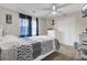 Spacious bedroom with a queen-size bed, ceiling fan, and ample closet space at 320 Harry Ln, Moncks Corner, SC 29461