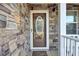 Charming front door with stone facade and glass accents at 320 Harry Ln, Moncks Corner, SC 29461