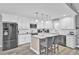 Modern kitchen with white cabinets, granite counters, and stainless steel appliances at 320 Harry Ln, Moncks Corner, SC 29461